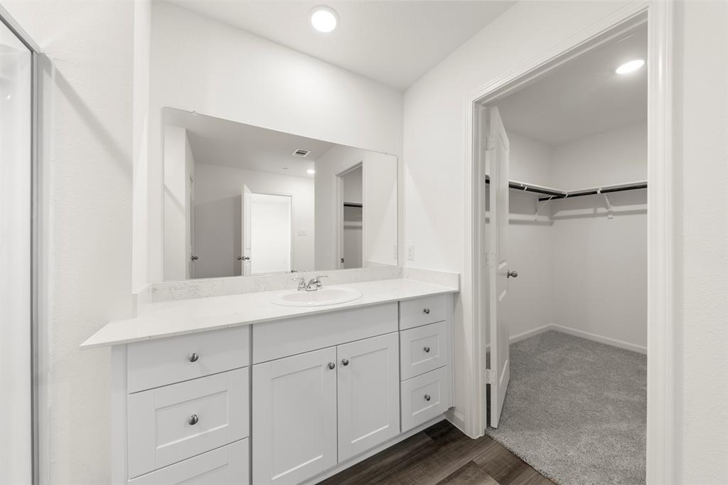 1444 Lake Alpine Trail Anna, TX 75409 - Photo 19 of 29 a bathroom with a double vanity sink and mirror
