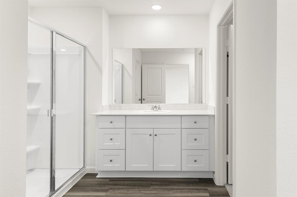 1444 Lake Alpine Trail Anna, TX 75409 - Photo 20 of 29 a bathroom with a sink and a mirror