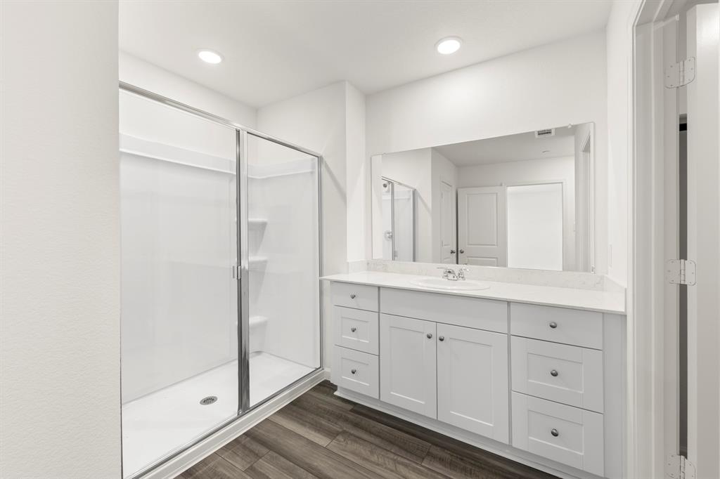 1444 Lake Alpine Trail Anna, TX 75409 - Photo 21 of 29 a bathroom with a double vanity sink and a mirror