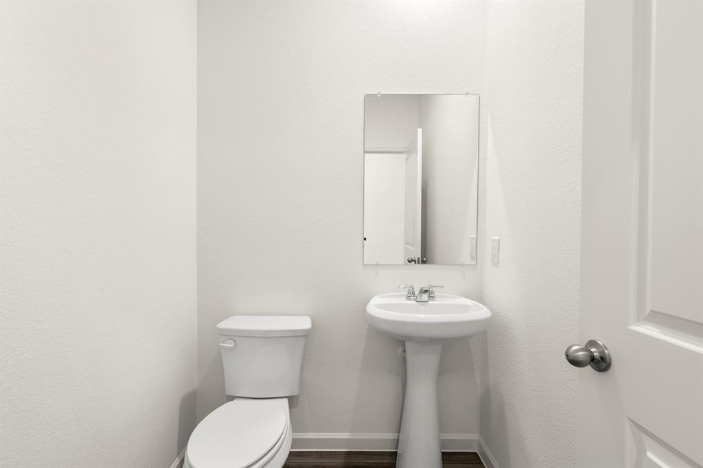 1444 Lake Alpine Trail Anna, TX 75409 - Photo 6 of 29 a bathroom with a sink mirror and toilet