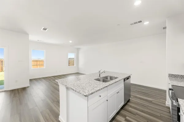 a spacious bathroom with a granite countertop sink and a granite