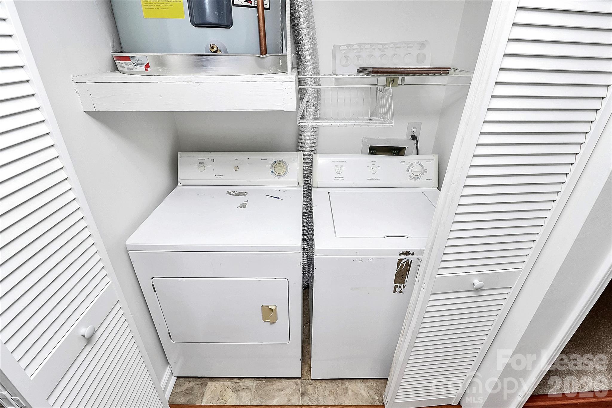 430 Queens Road, Unit 711 Charlotte, NC 28204 - Photo 12 of 20 a utility room with dryer and washer