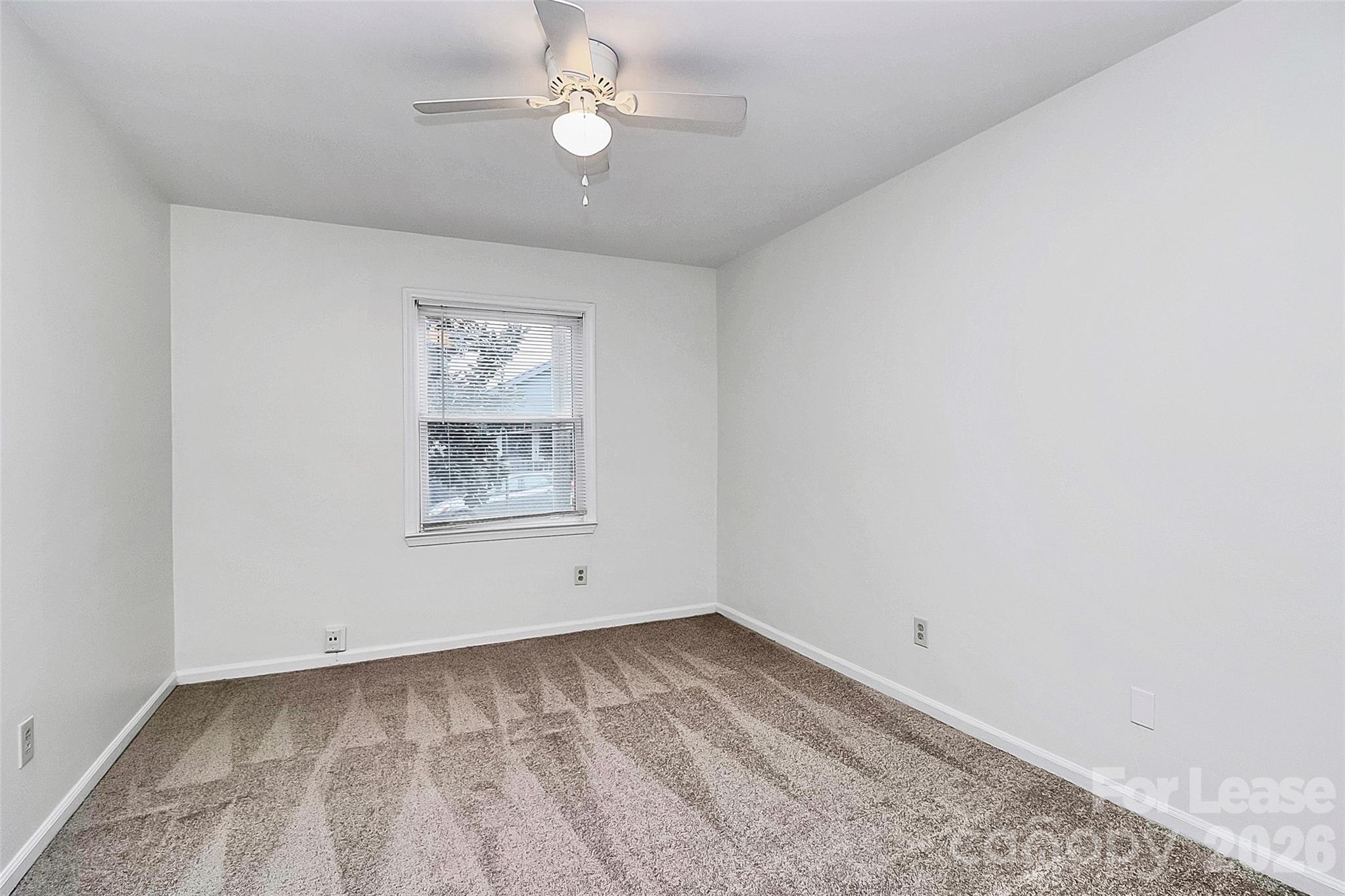 430 Queens Road, Unit 711 Charlotte, NC 28204 - Photo 15 of 20 wooden floor in an empty room with a window