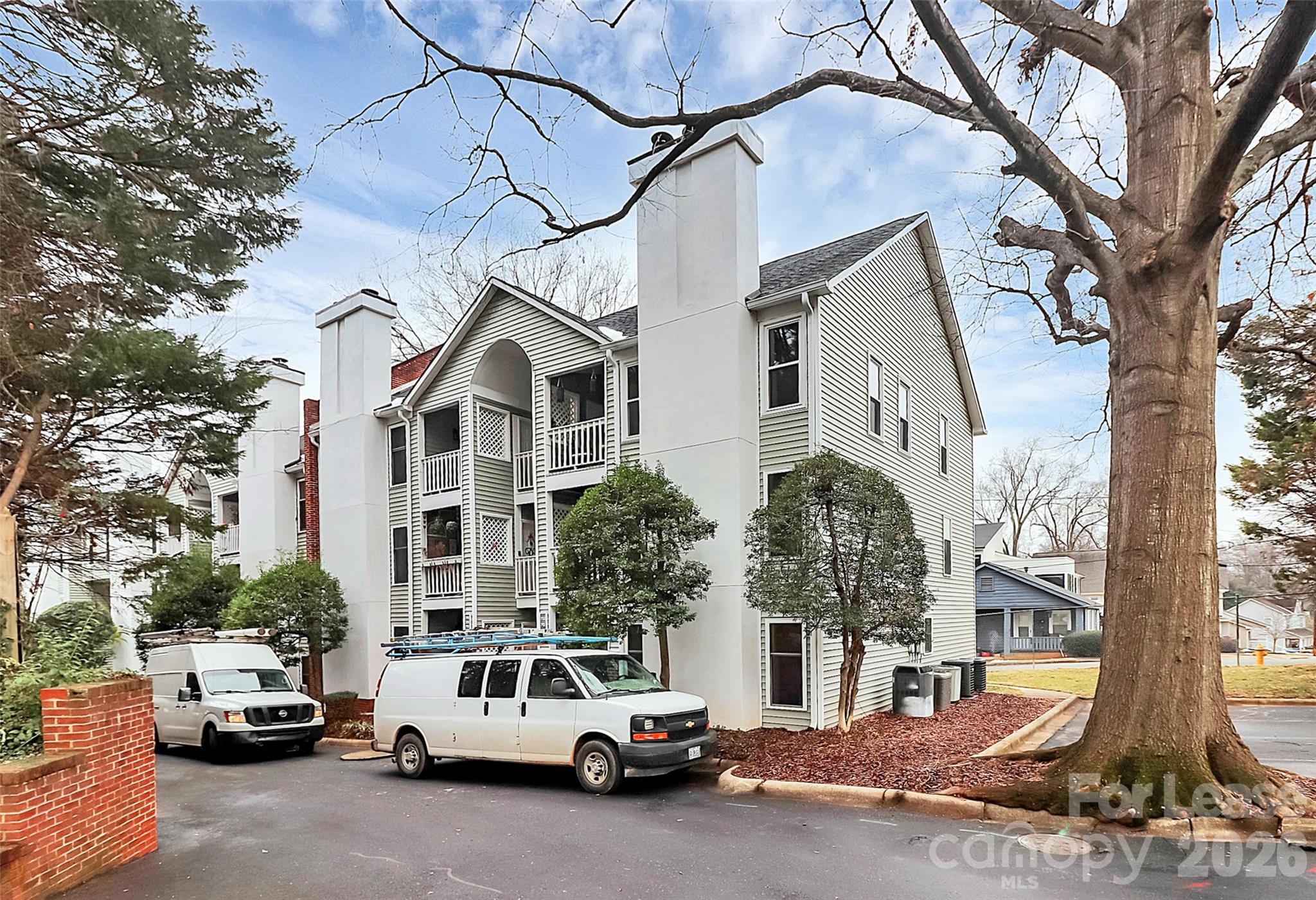 430 Queens Road, Unit 711 Charlotte, NC 28204 - Photo 2 of 20 a car parked in front of a house