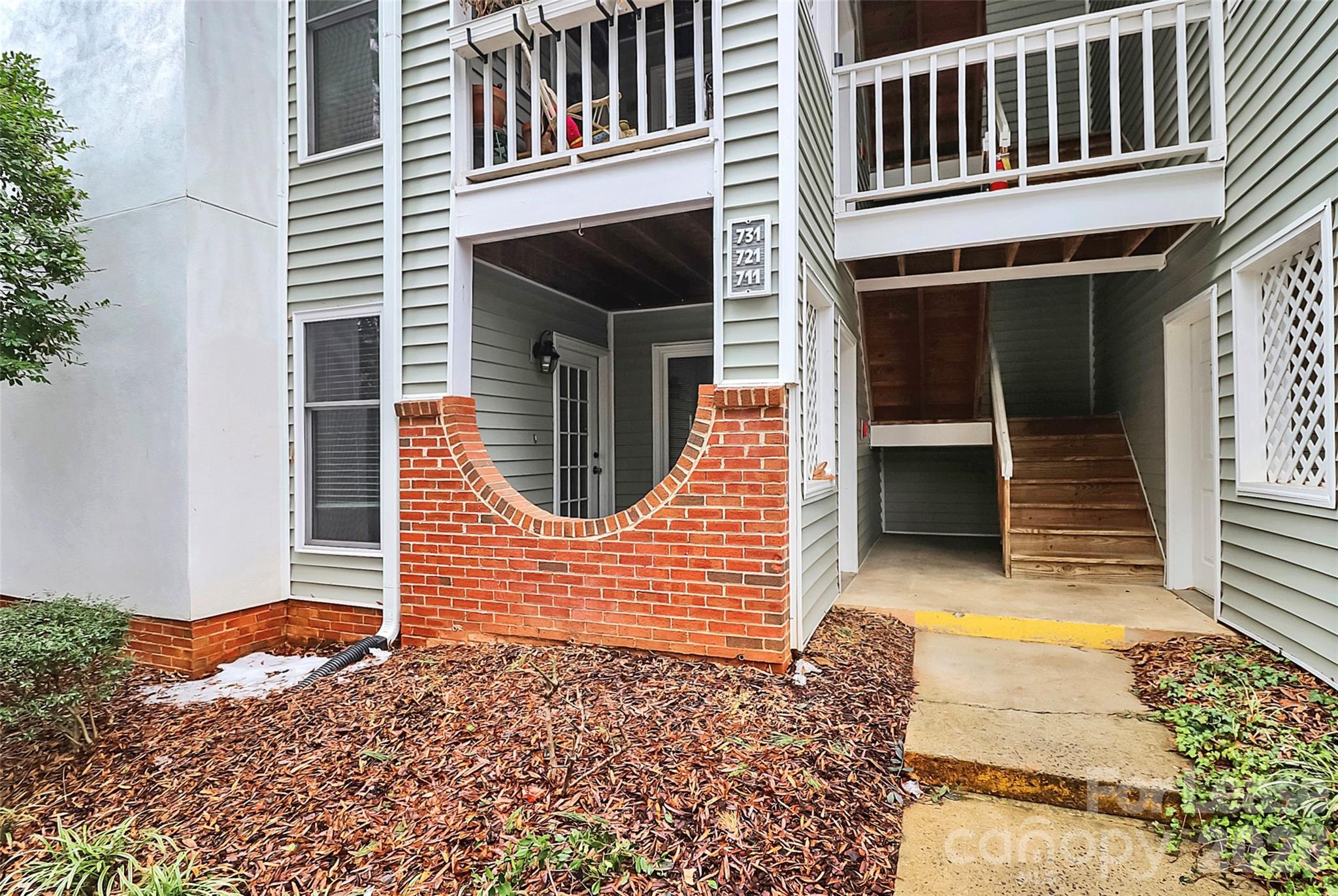 430 Queens Road, Unit 711 Charlotte, NC 28204 - Photo 3 of 20 a front view of a house with a door