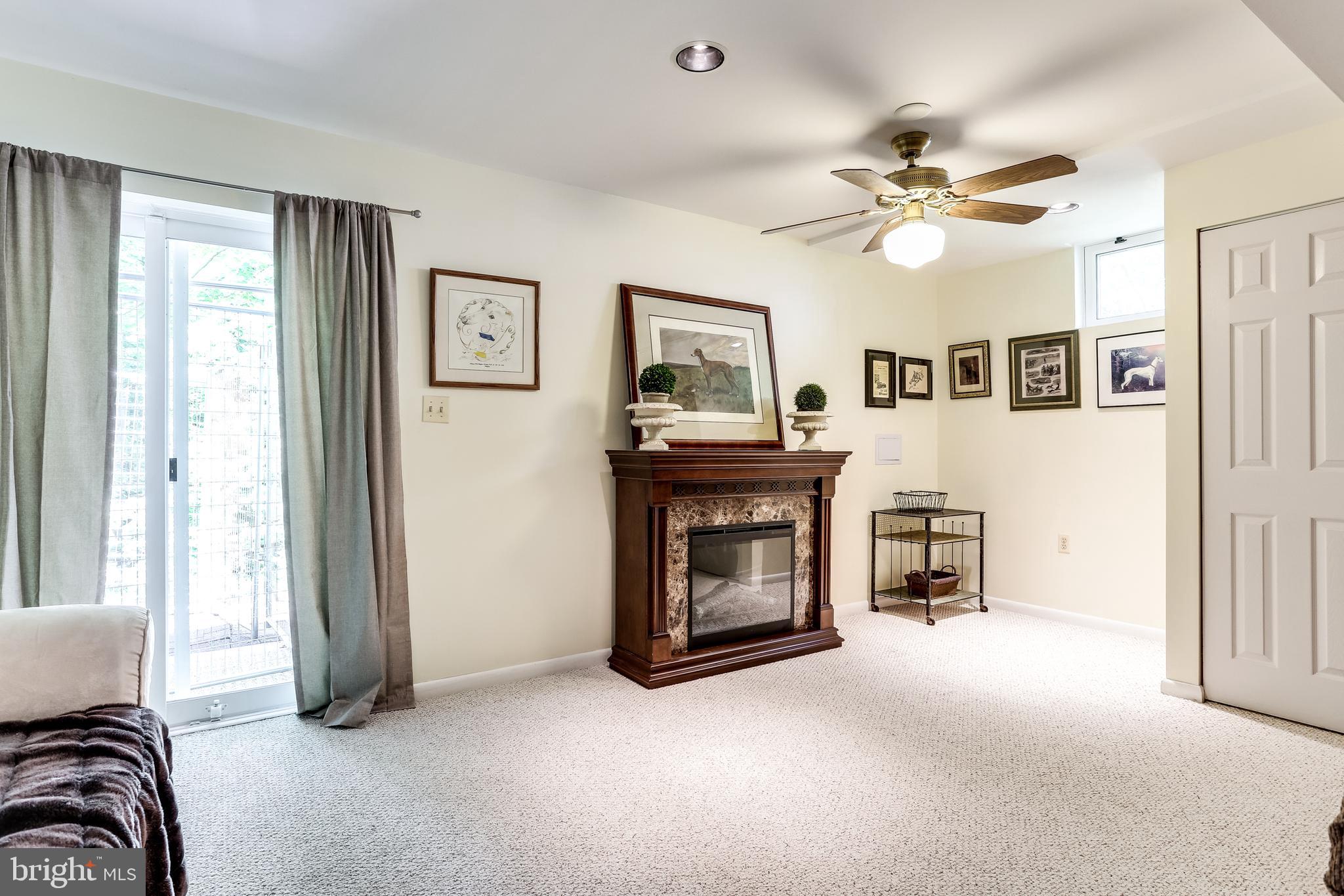 4828 Hawksbury Road Baltimore, MD 21208 - Photo 22 of 30 Family Room w/ Walk-Out Sliders