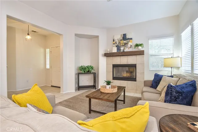 a living room with furniture or couch and a fireplace