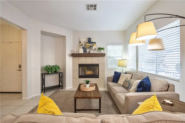 a kitchen with a refrigerator a stove a sink dishwasher with a dining table and chairs