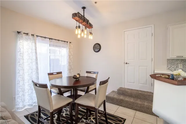 a kitchen with stainless steel appliances granite countertop a refrigerator a stove and a sink