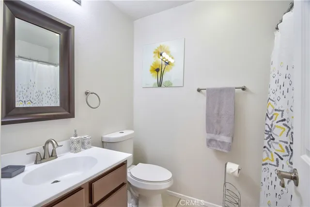 a bathroom with a shower curtain
