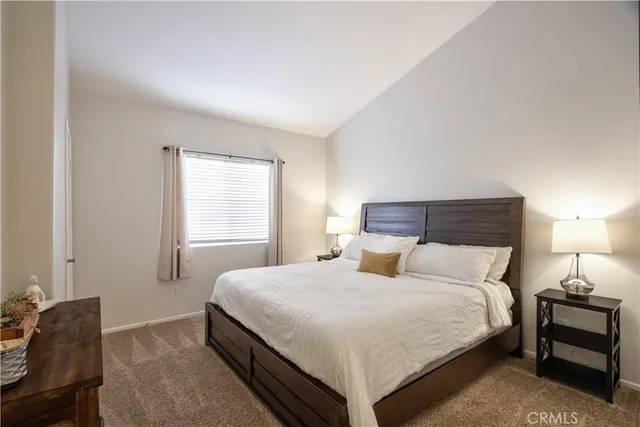 a bedroom with a bed and dresser