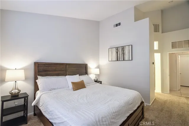 a bathroom with a double vanity sink mirror and shower