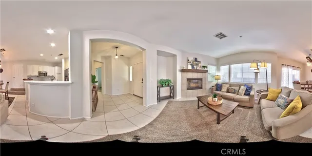 a living room with furniture flowerpot and a window