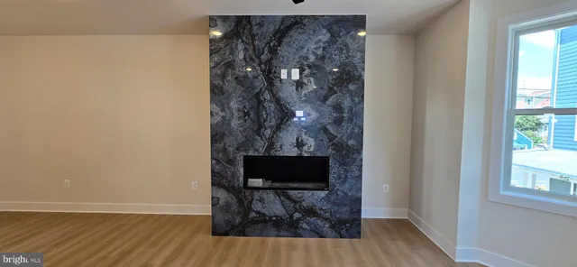 a room with a door and wooden floor