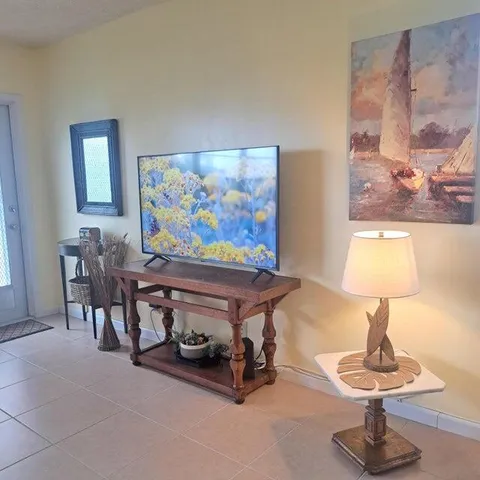 a room with furniture and painting on the wall