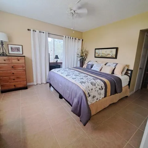 a bedroom with a bed and a cabinets
