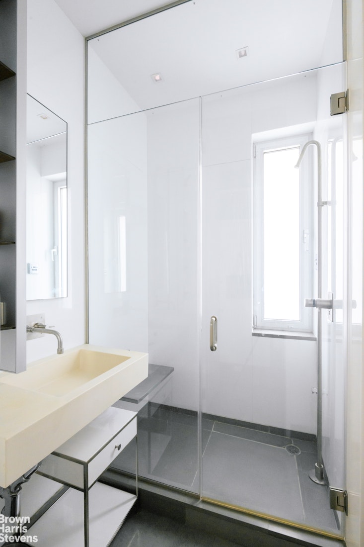 1000 Park Avenue, Unit 7F Manhattan, NY 10028 - Photo 6 of 7 a room with a table and chairs