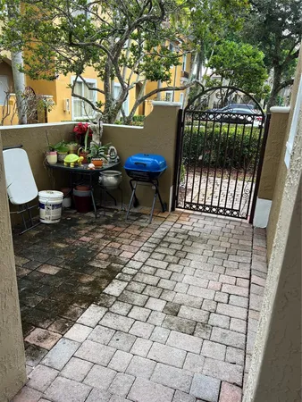 a view of a chairs and table in backyard