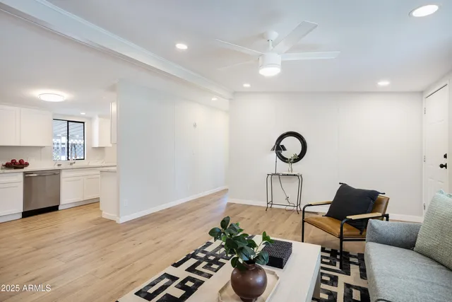 a view of workspace with furniture and wooden floor