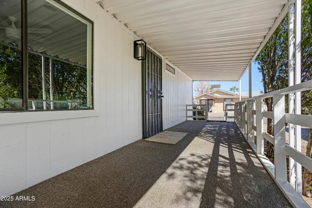 a view of balcony with wooden floor and stairs
