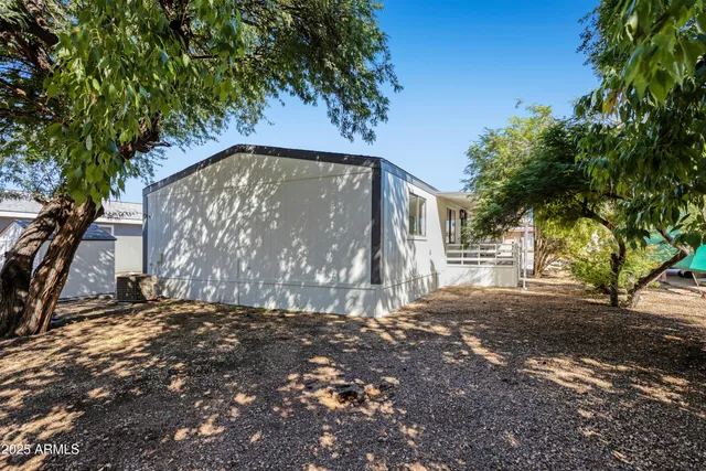a view of a house with a tree