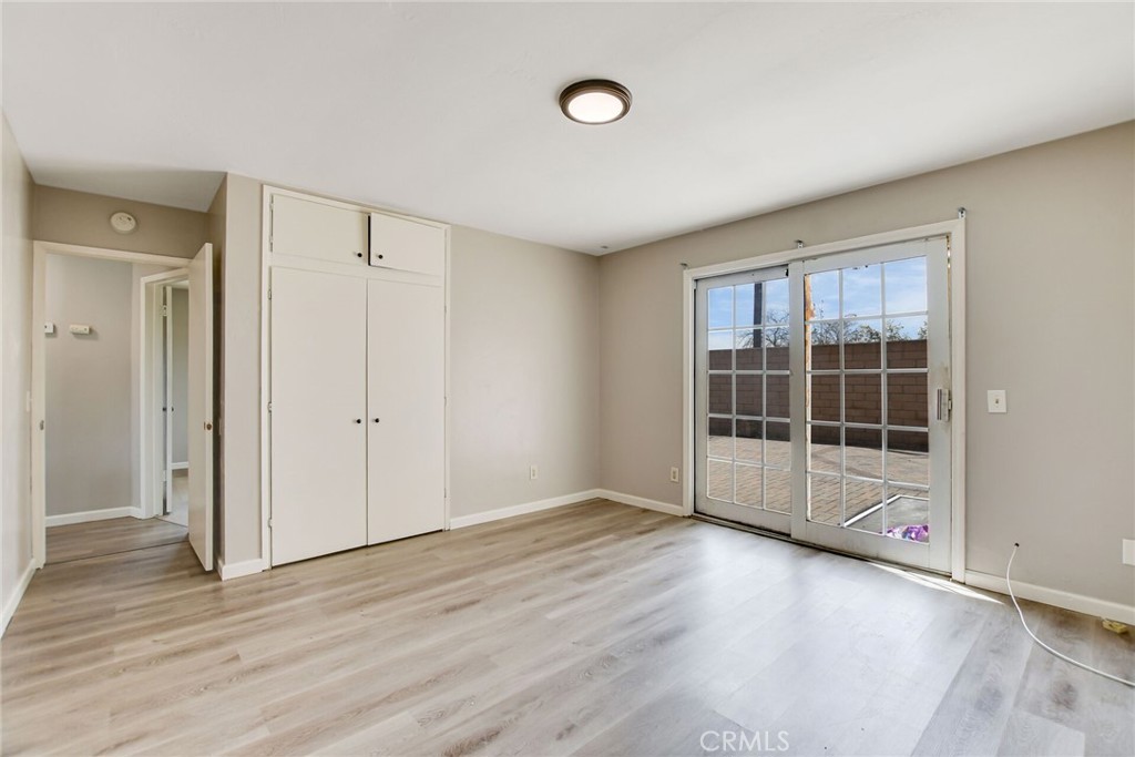 582 Wesley Street Banning, CA 92220 - Photo 23 of 49 a view of a room with wooden floor and window