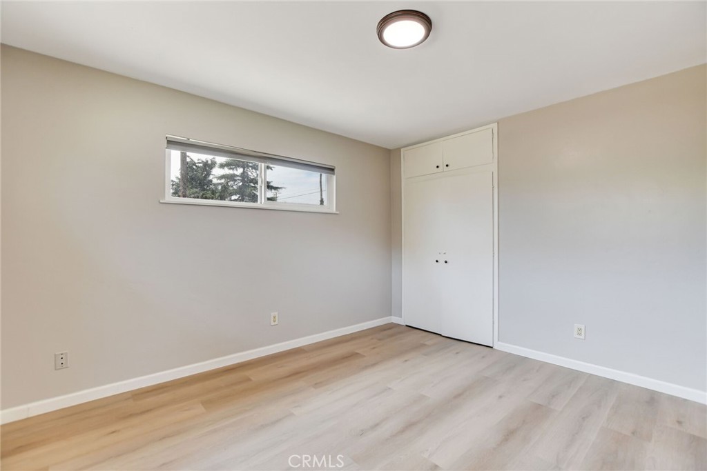 582 Wesley Street Banning, CA 92220 - Photo 26 of 49 a view of a room with wooden floor and window