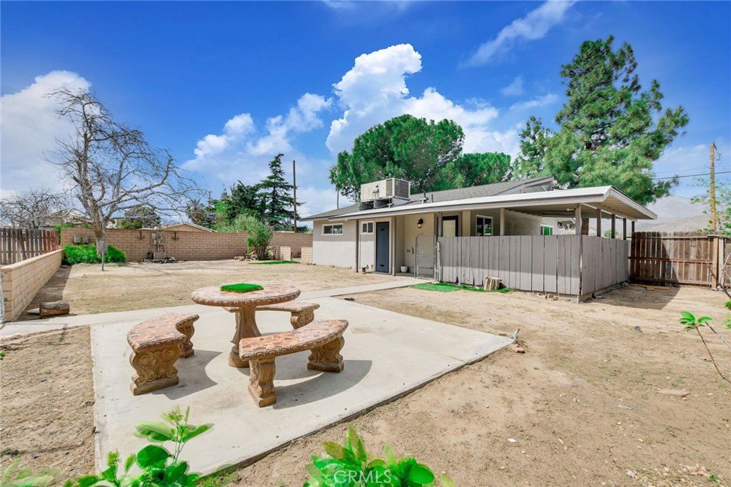 582 Wesley Street Banning, CA 92220 - Photo 29 of 49 a view of a house with backyard and sitting area