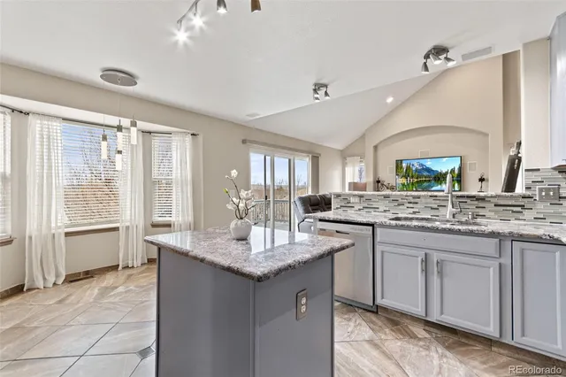 a spacious bathroom with a double vanity sink a mirror and a shower