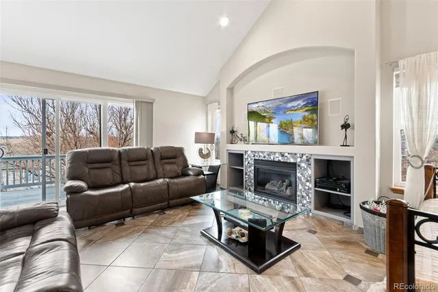 a view of an empty room with window and cabinet