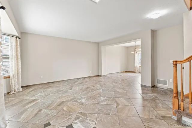 a view of balcony with wooden floor and fence