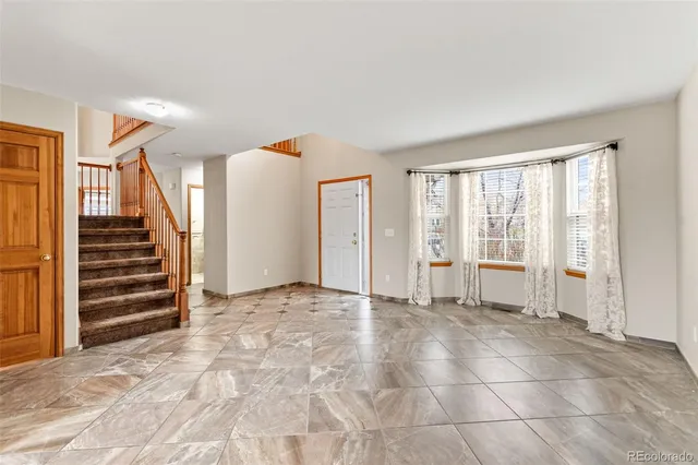 a view of an empty room and glass door