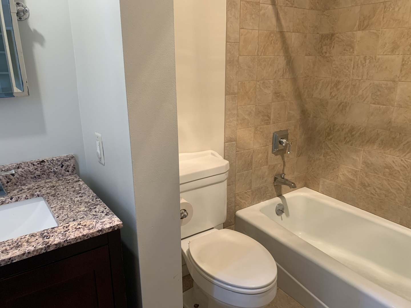 205 Herrick Road Riverside, IL 60546 - Photo 12 of 28 a bathroom with a granite countertop sink toilet and shower