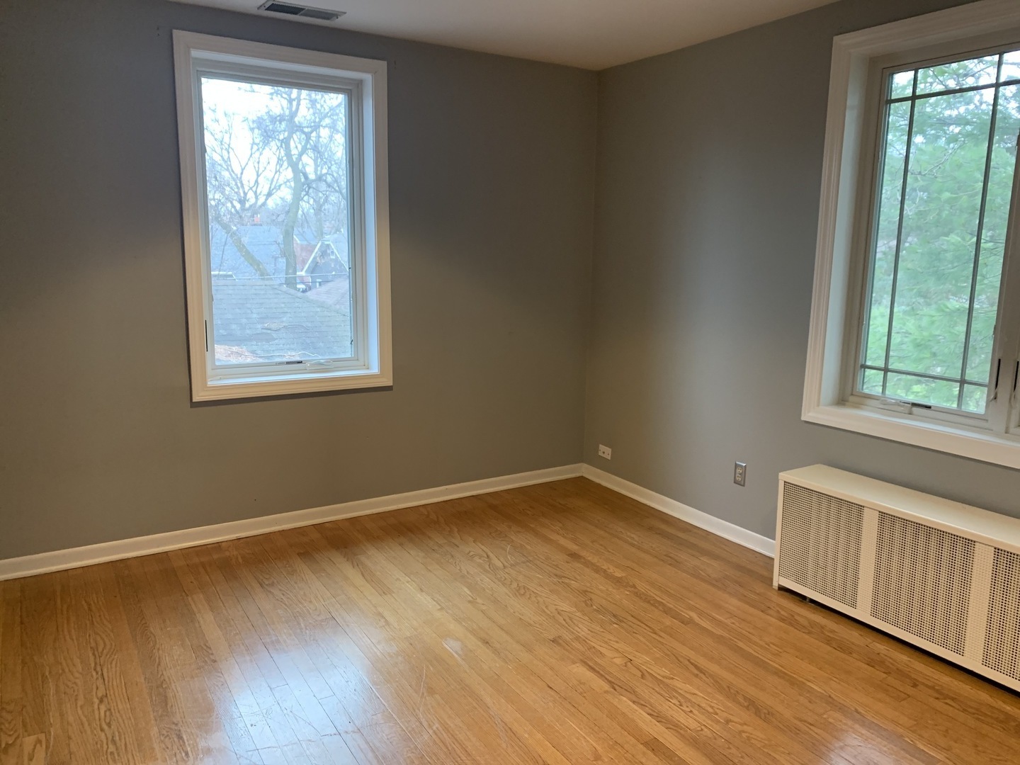 205 Herrick Road Riverside, IL 60546 - Photo 18 of 28 a view of an empty room with wooden floor and a window
