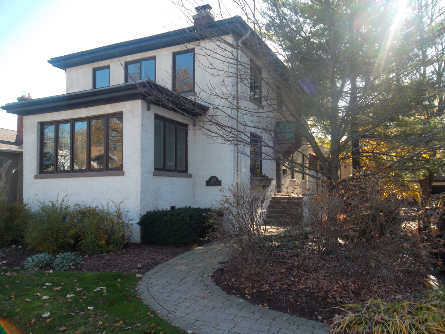 205 Herrick Road Riverside, IL 60546 - Photo 3 of 28 a front view of a house with garden