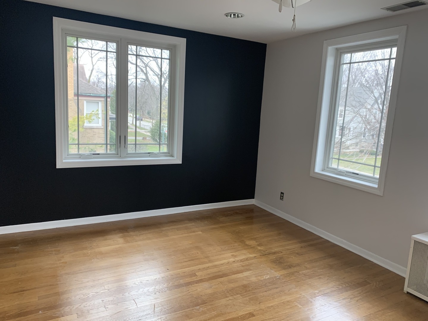 205 Herrick Road Riverside, IL 60546 - Photo 22 of 28 a view of an empty room with wooden floor and a window