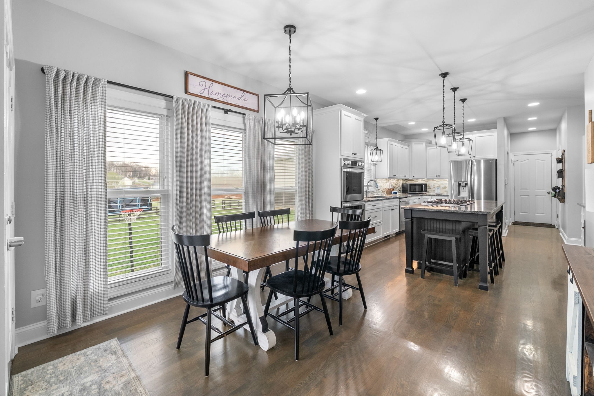 3021 7 Mile Ferry Road Clarksville, TN 37040 - Photo 18 of 99 a view of a dining room with furniture window and wooden floor