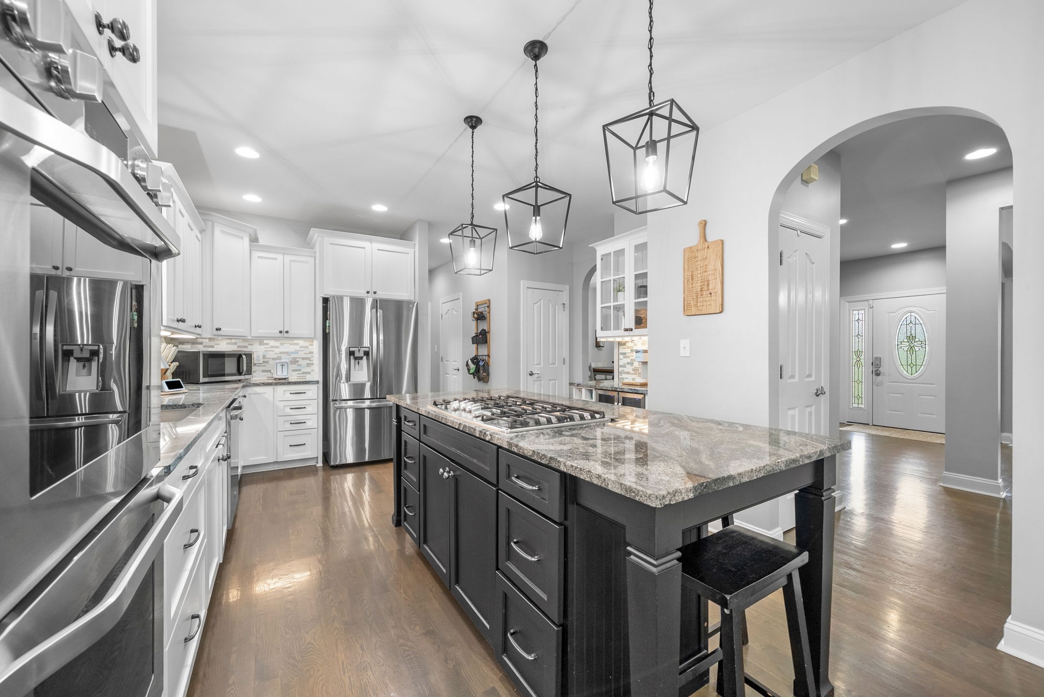 3021 7 Mile Ferry Road Clarksville, TN 37040 - Photo 23 of 99 a kitchen with stainless steel appliances granite countertop a sink refrigerator and cabinets