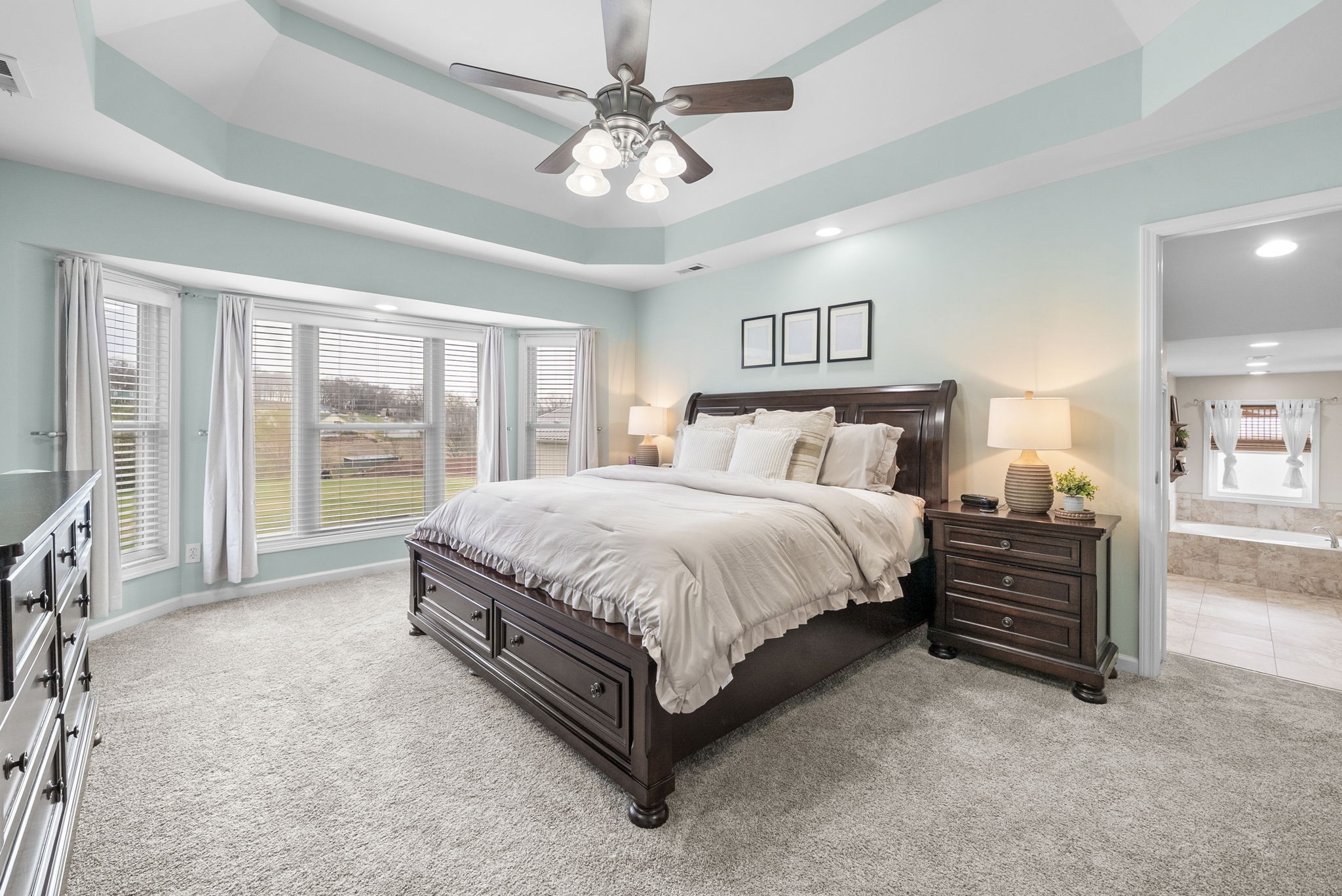 3021 7 Mile Ferry Road Clarksville, TN 37040 - Photo 34 of 99 a spacious bedroom with a bed and a chandelier