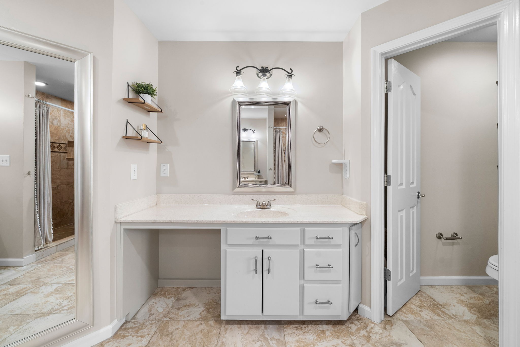 3021 7 Mile Ferry Road Clarksville, TN 37040 - Photo 38 of 99 a bathroom with a granite countertop sink a toilet and a mirror