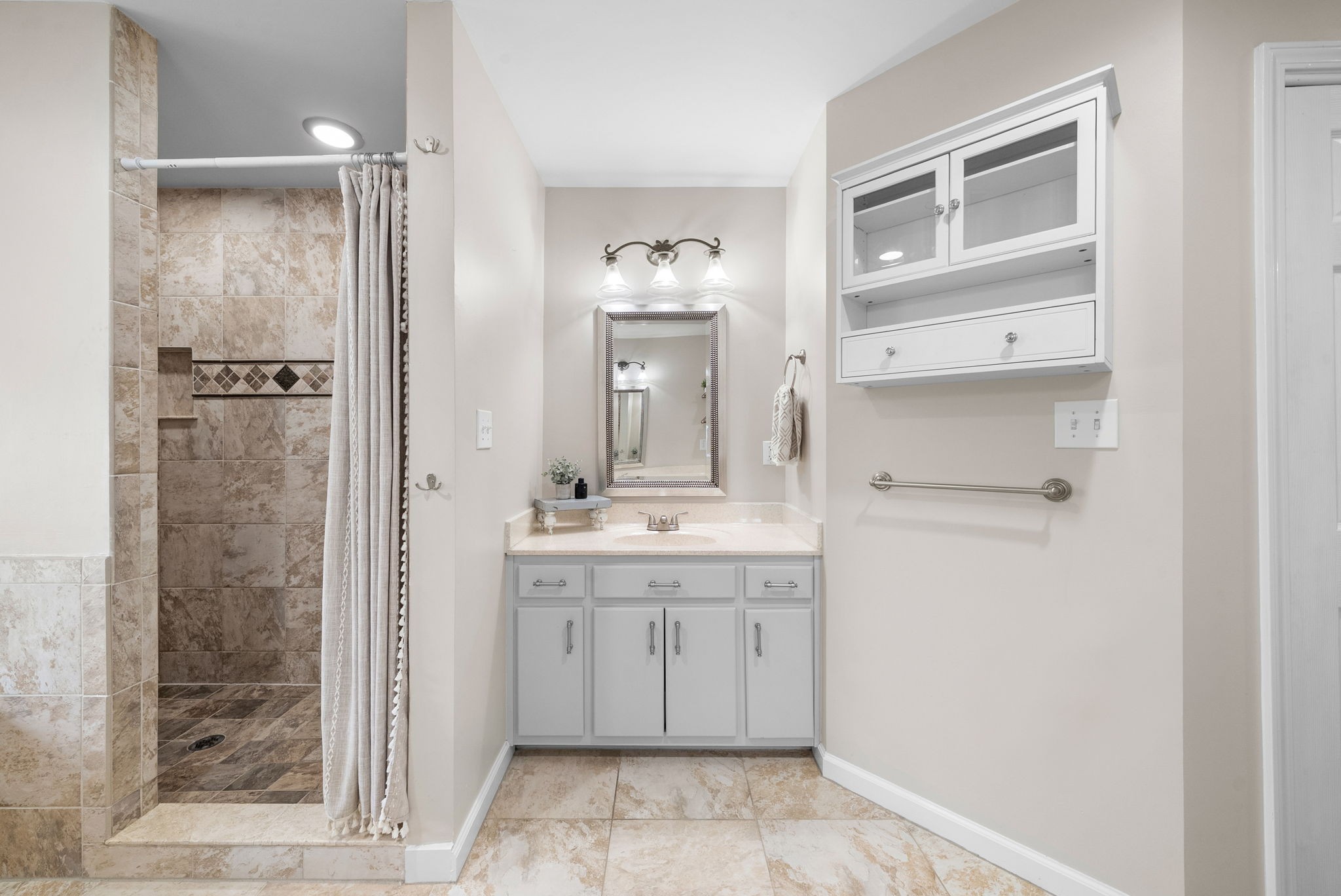 3021 7 Mile Ferry Road Clarksville, TN 37040 - Photo 39 of 99 a bathroom with a sink a toilet and shower