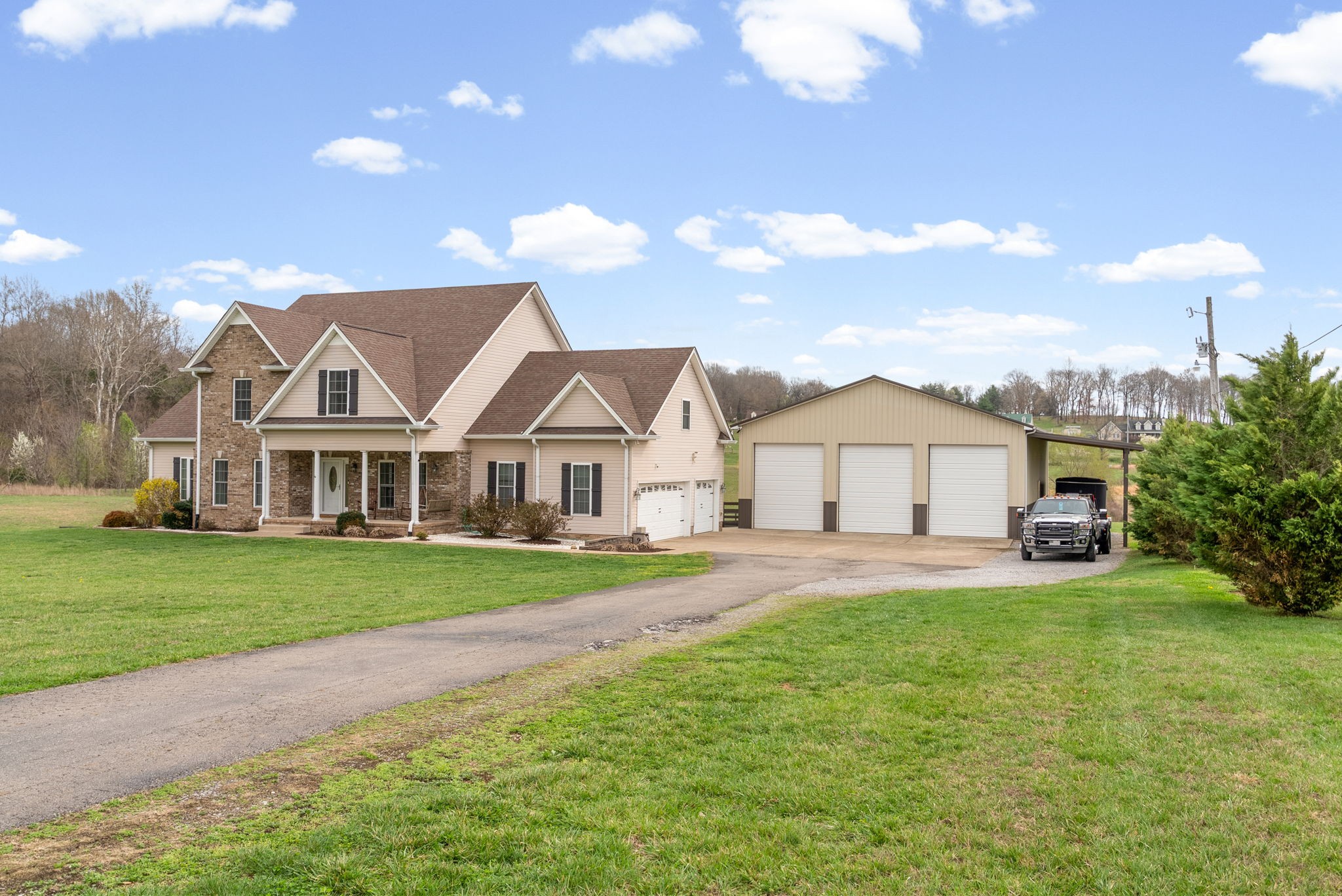3021 7 Mile Ferry Road Clarksville, TN 37040 - Photo 4 of 99 a view of a big house with a big yard and large trees