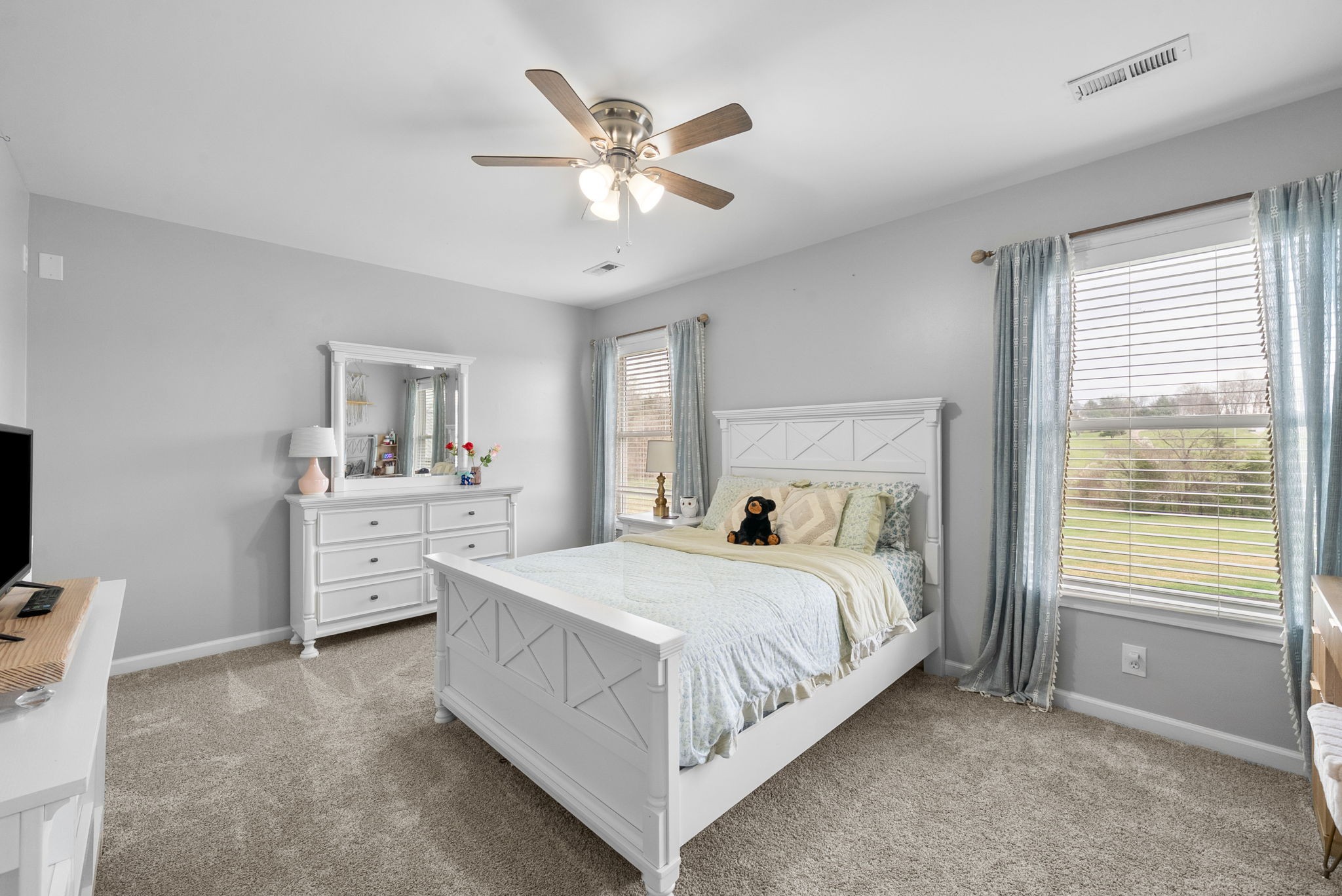 3021 7 Mile Ferry Road Clarksville, TN 37040 - Photo 45 of 99 a bedroom with a large bed and a chandelier