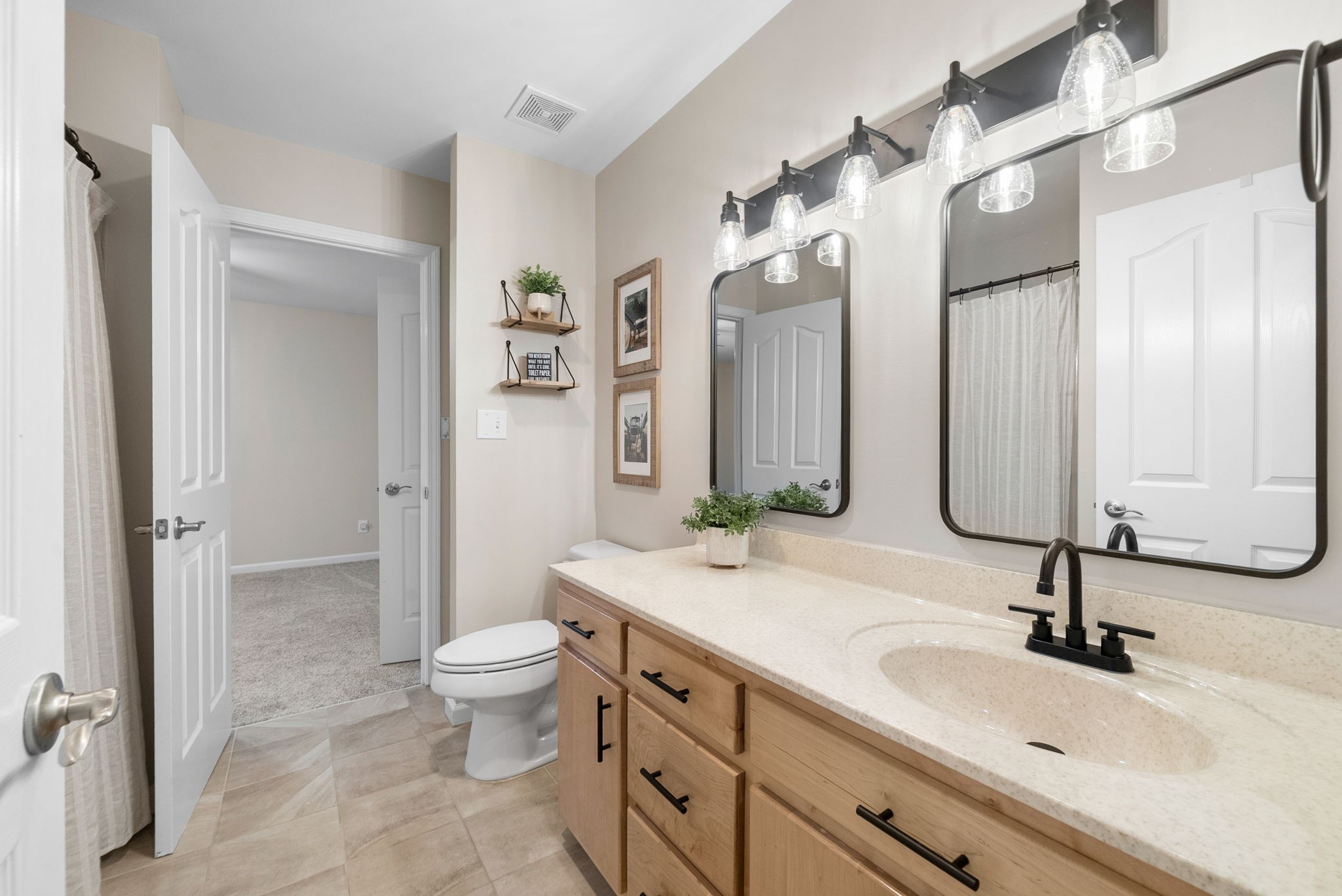 3021 7 Mile Ferry Road Clarksville, TN 37040 - Photo 52 of 99 a bathroom with a sink double vanity and a mirror