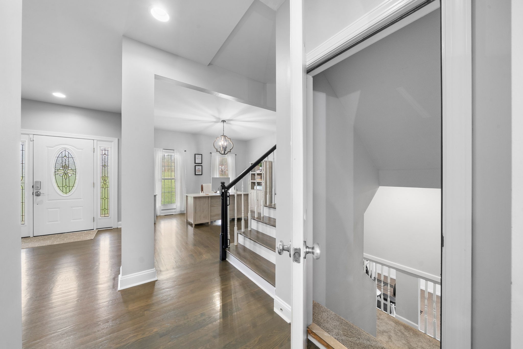 3021 7 Mile Ferry Road Clarksville, TN 37040 - Photo 57 of 99 a view of a hallway with entryway wooden floor and front door