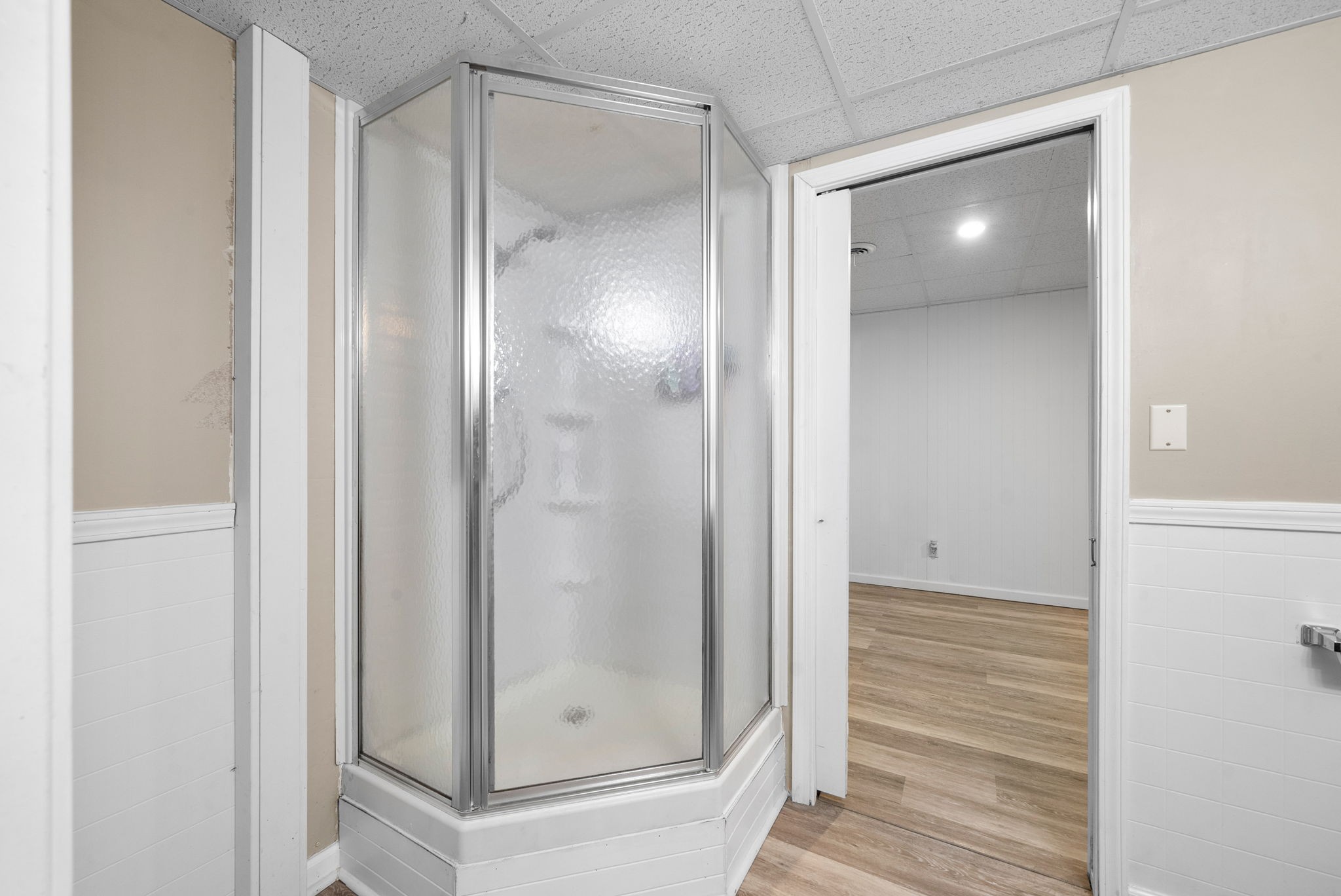 3021 7 Mile Ferry Road Clarksville, TN 37040 - Photo 62 of 99 a bathroom with a glass shower door and a sink