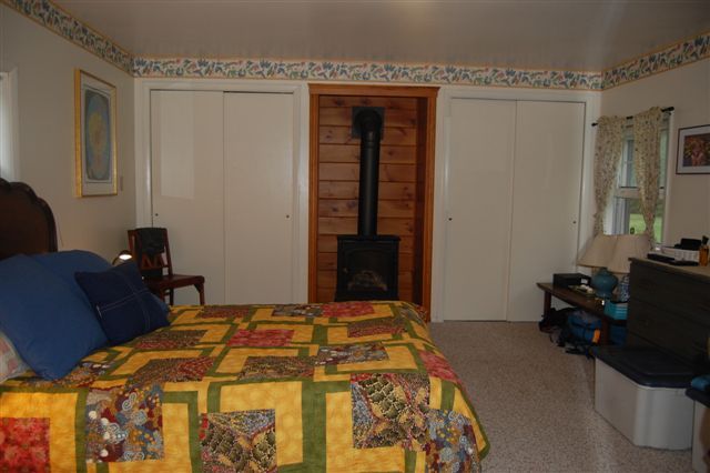 33 Hemlock Road Richmond, MA 01201 - Photo 8 of 10 a bedroom with a bed and wooden floor
