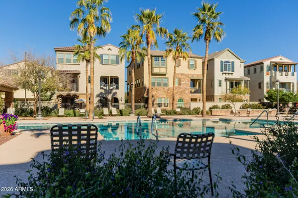 a view of a patio with table and chairs and potted plants
