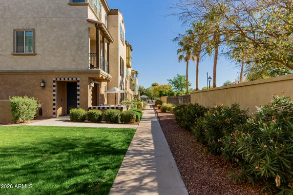 a view of a pathway with a house in the background