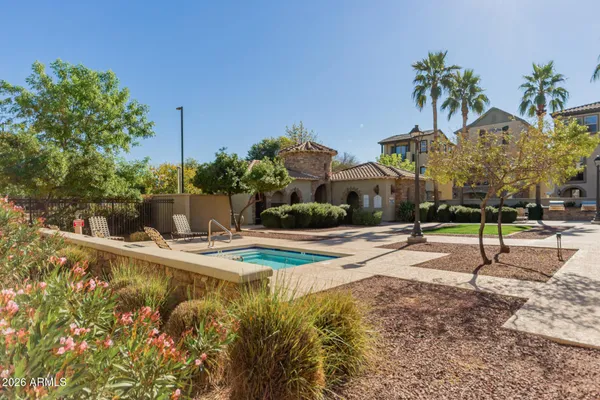 a house with palm tree in front of it